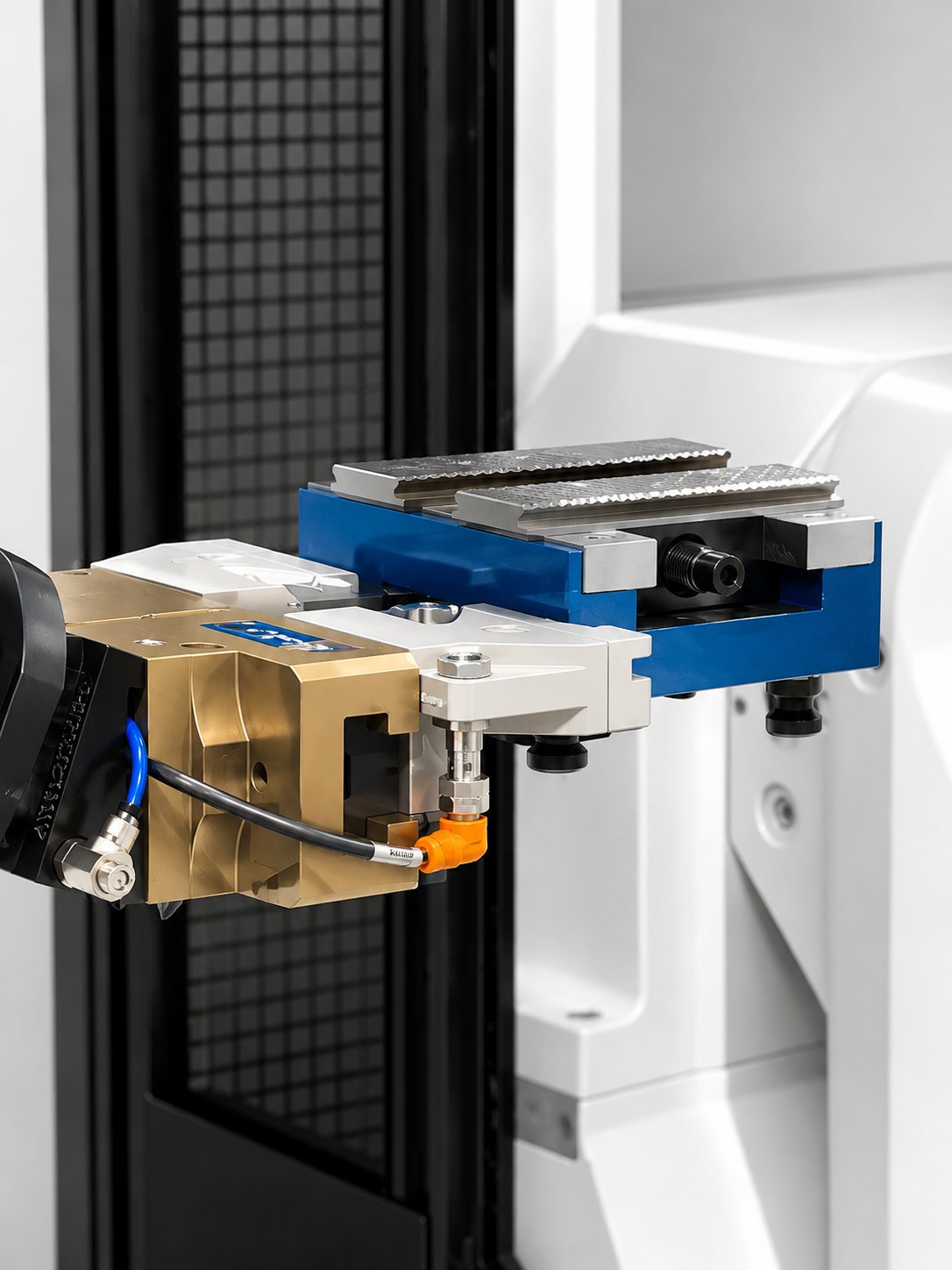 Parallel gripper holding a blue vise inside a machining cell